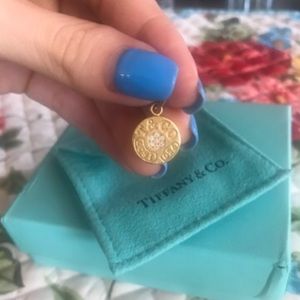 Tiffany gold charm pendant.
